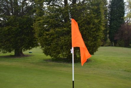 flourescent orange tie on flag