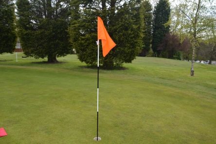 flourescent orange tie on flag for golf football or rugby