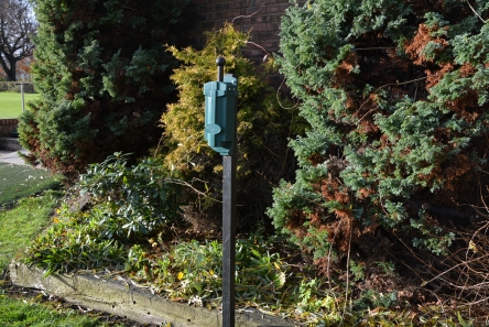 golf ball washer on black post