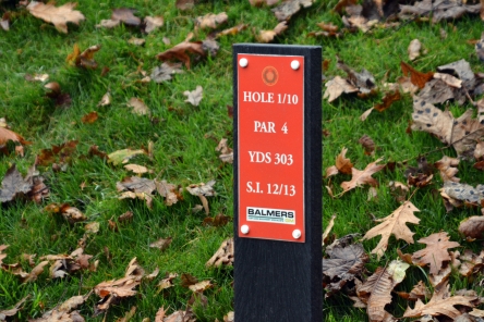 recycled plastic post with tee information on golf course